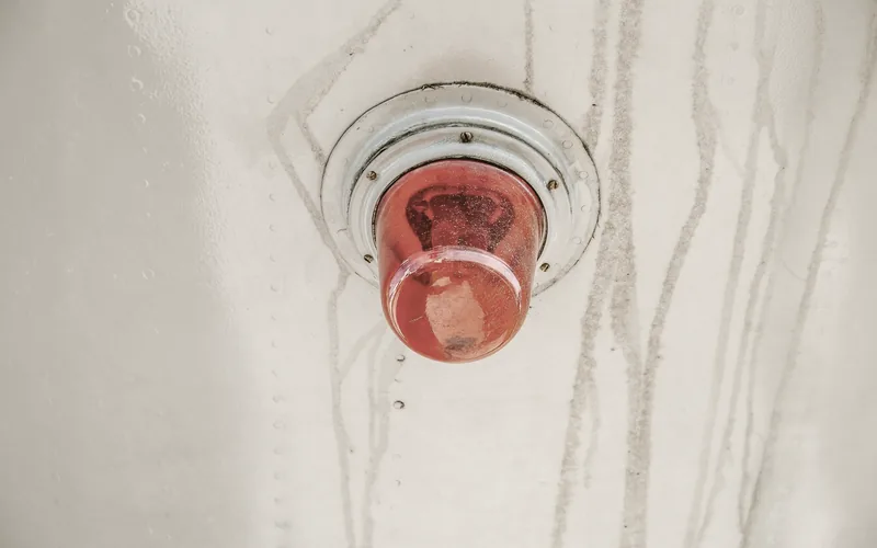 A warning light glowing in a dark room