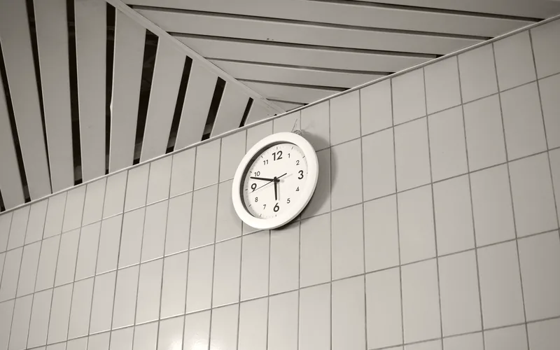 A clock on a waiting room wall