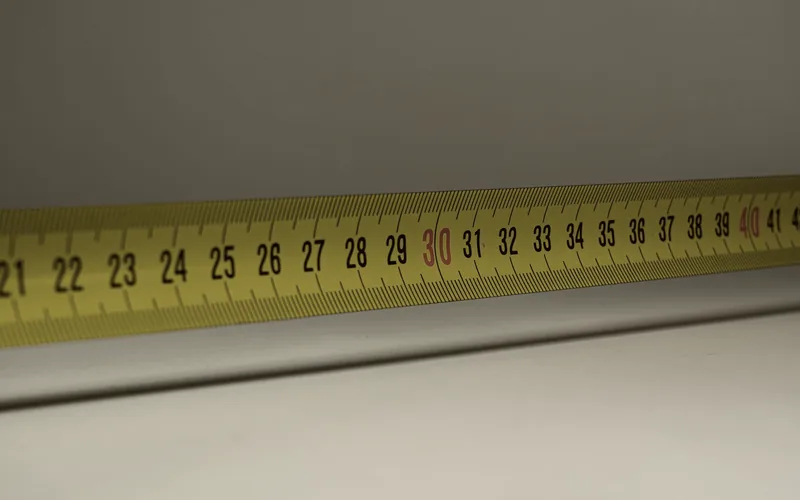 A measuring tape and hand tools