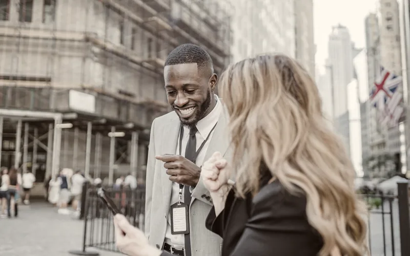 People talking on a busy city street
