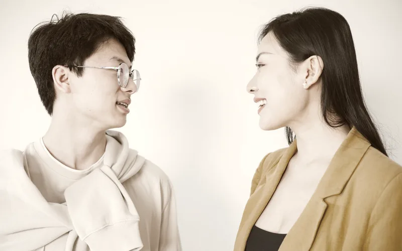 Two people in conversation across a table