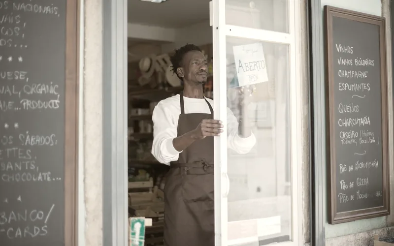 A small business owner working in their shop
